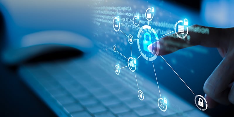  Close-up of a finger touching a digital display showing cybersecurity icons with a central lock symbol connected to various device and communication icons, illustrating the secure networking features of FirstNet® certified devices.