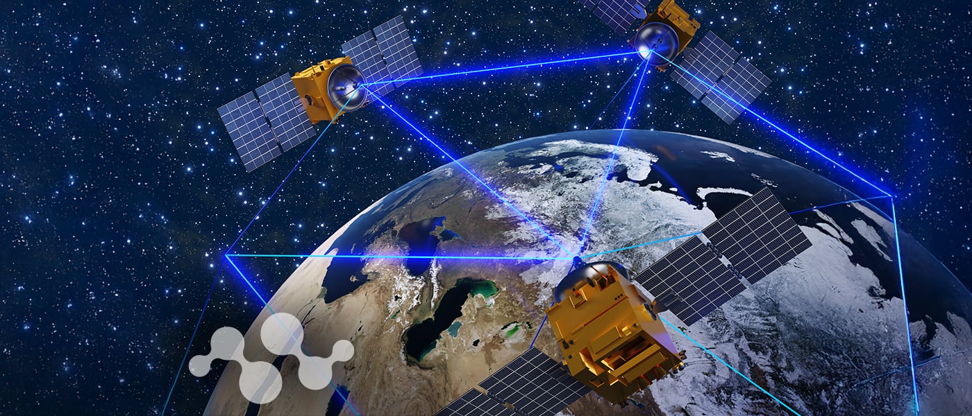 Multiple satellites forming communication network around Earth with blue data transmission beams, representing satellite IoT infrastructure and non-terrestrial network technology.